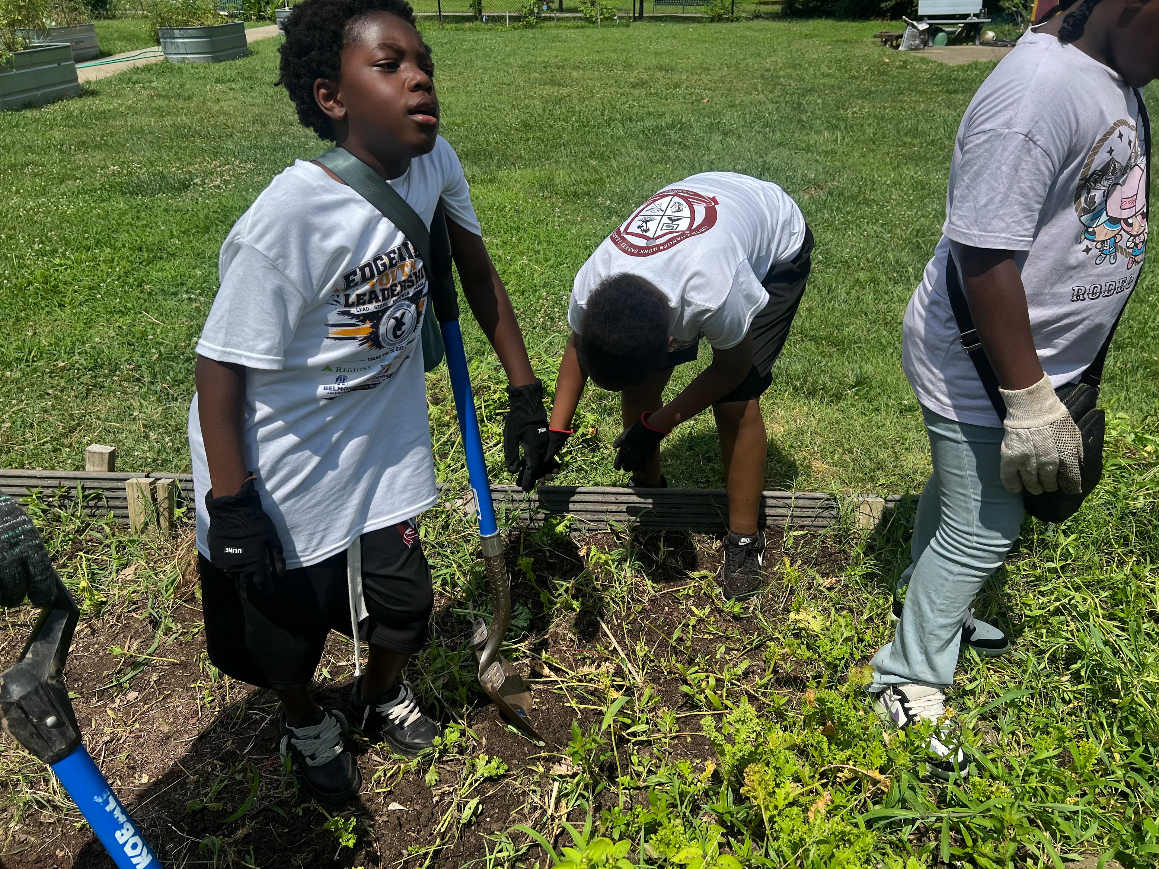 Youth leadership program participants at garden